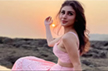 Mouni Roy picks a pretty pastel pink schiffli skirt set for an outdoorsy look